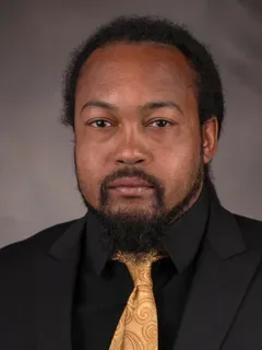 Dominique Battle headshot